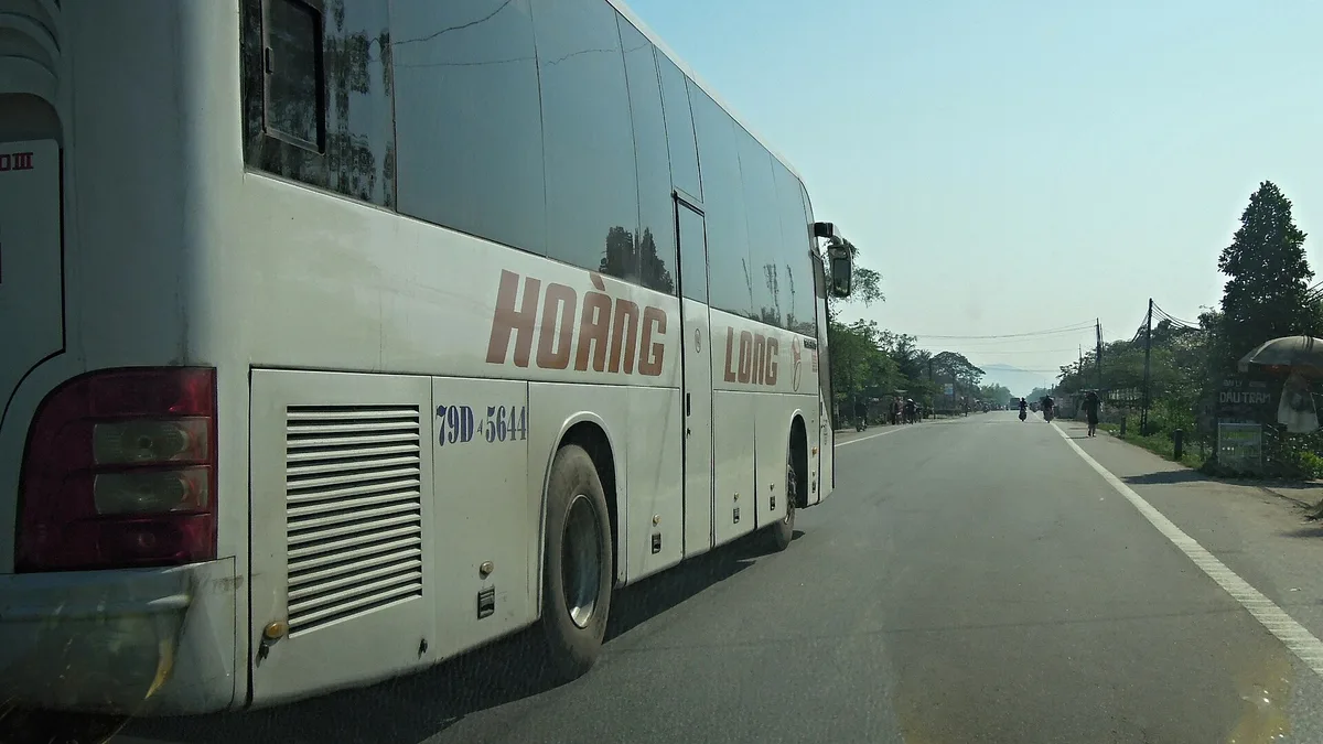 Coach overtaking our car on Highway 1, Thừa Thiên-Huế provin – Laos coastline